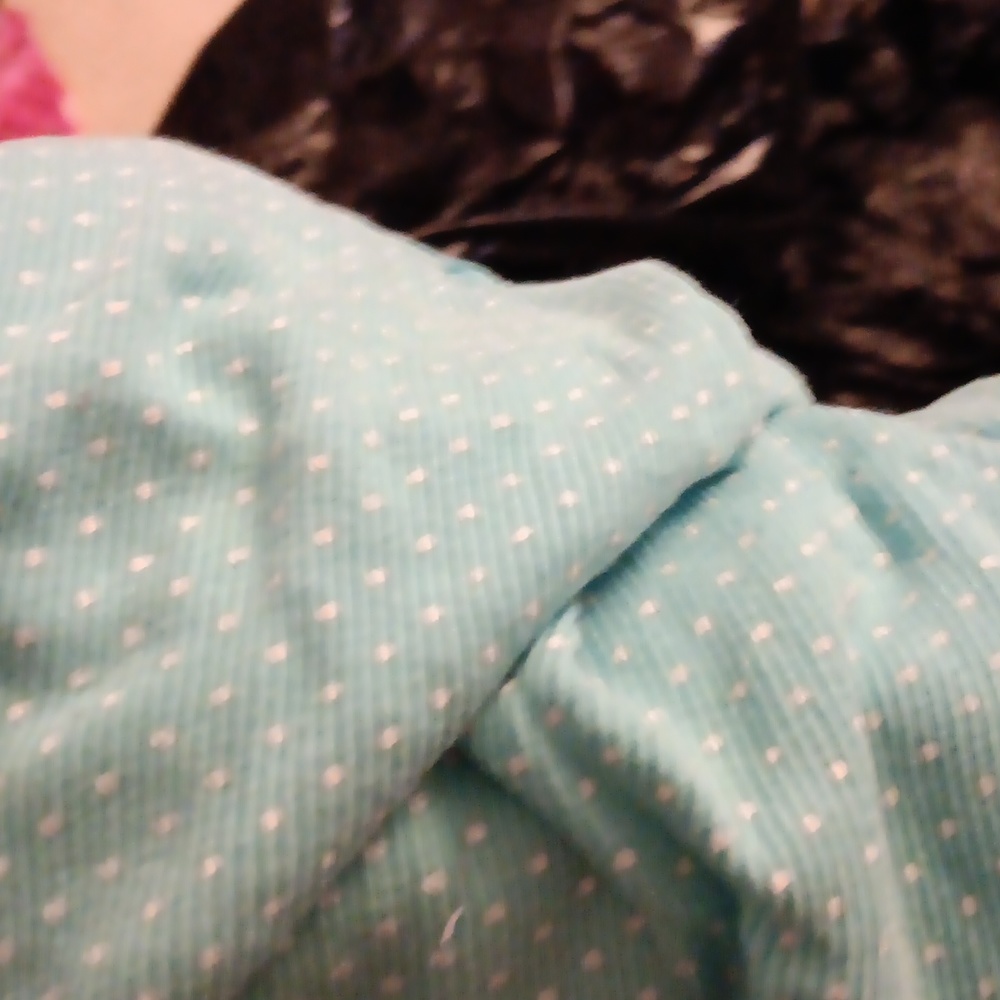 A blue shirt with polka dots